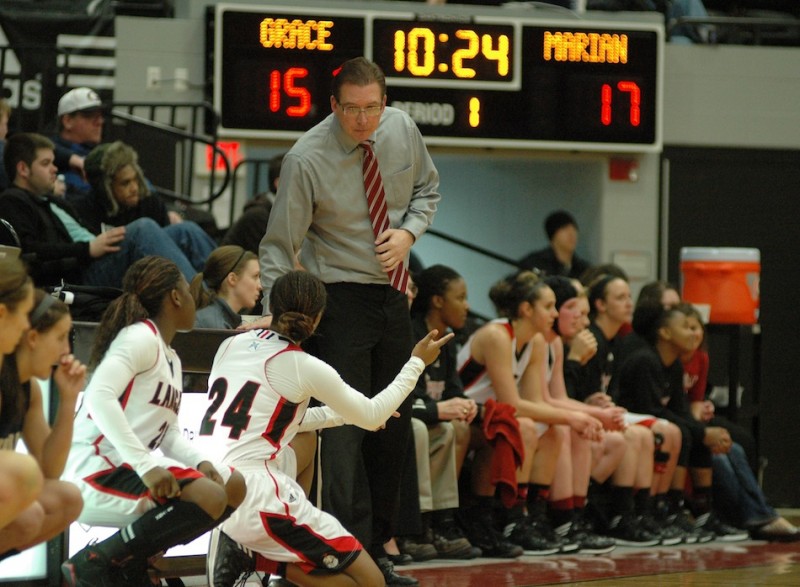 Grace College women's basketball coach Scott Blum gives instructions during action Tuesday night. Marian edged host Grace 71-67 in a first-round game of the Croossroads League Tournament (Photos provided by Patrick Stukkie)