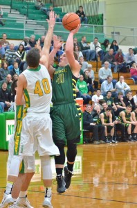 Alex Clark puts up a seriously contested shot over Northridge's Nate Ritchie. (Photos by Nick Goralczyk)