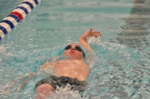 Valley's John Paul Secrest swims the 100 backstroke during Thursday's prelims. (Photos by Nick Goralczyk)
