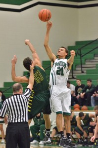 Nate Thomas wins the tip for South Side. Thomas led all scorers with 24 points. (Photos by Nick Goralczyk)