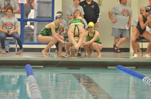 Valley's 400 relay team watches its first swimmer take off.