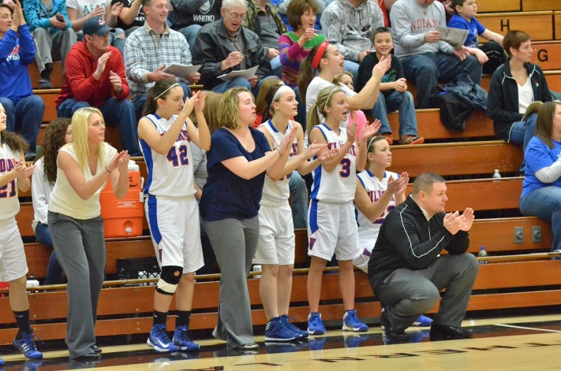 The Whitko bench cheers on the Lady Wildcats after the team jumped out to an 8-0 lead. (Photos by Nick Goralczyk)