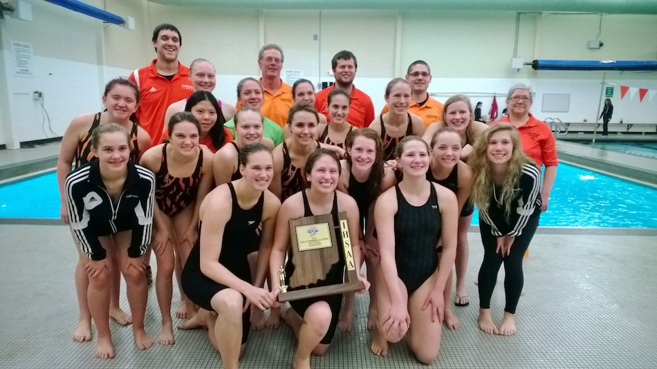 The Warsaw girls swim team proudly displays their sectional championship trophy Saturday (Photo provided)