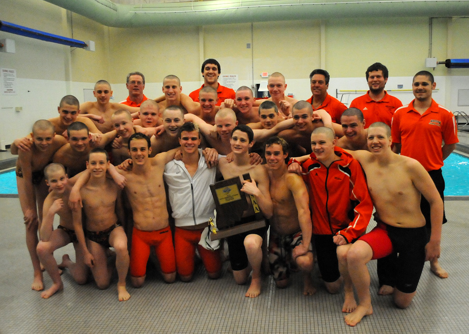 Warsaw's boys swim team celebrates its seventh consecutive sectional championship with its win Saturday at the Warsaw Boys Swimming Sectional. (Photos by Mike Deak)