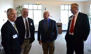 Steve Harris, Tyler Haines, Mark Caruso and David Cates, primary judge candidates for Kosciusko Superior Courts 1 and 2 take a few minutes to talk together before the program. (Photo by Deb Patterson)