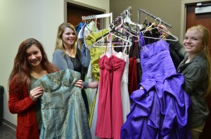 From left are Lacey Lisenbee, Cailin Clay and Ashlyn Vitoux. The girls are coordinating this year's Glass Slipper event that will fit county high school girls with free prom dresses and accessories. (Photo by Stacey Page)