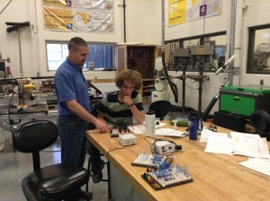 Teacher Allen Coblentz, left, helps student Austin Krizman with a wiring circuit simulation board during the digital electronics class at Wawasee High School. It is one of the Project Lead The Way classes offered at the school.