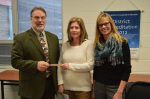 Dr. Tom Edington, left, superintendent of the Wawasee Community School Corp., accepted a donation check in the amount of $1,800 from Paula Ratliff, middle, representing Women of Today. Also shown is Rebecca Linnemeier, president of the Wawasee school board.