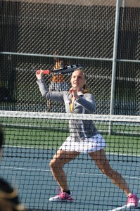 Warsaw's Abbi Baum readies for a return at the net in doubles action Tuesday (Photos by Amanda Farrell)