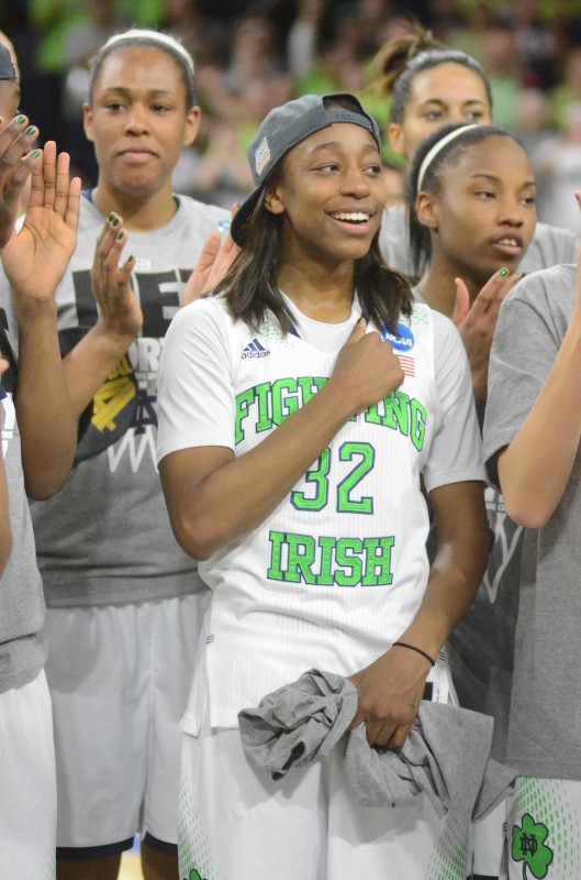 Jewell Loyd celebrates with her Irish teammates Monday night. The No. 2 and undefeated Irish beat Baylor to advance to the Final Four.
