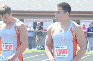 Mike Miller (left) and Tristan McClone chat after placing second and fourth in the 100 Saturday.
