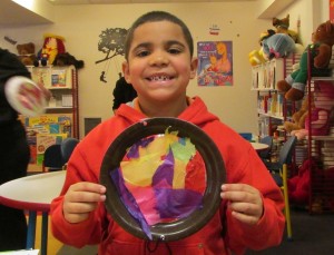 Dave Almiray makes a colorful sun catcher during our Spring Break Crafts week.