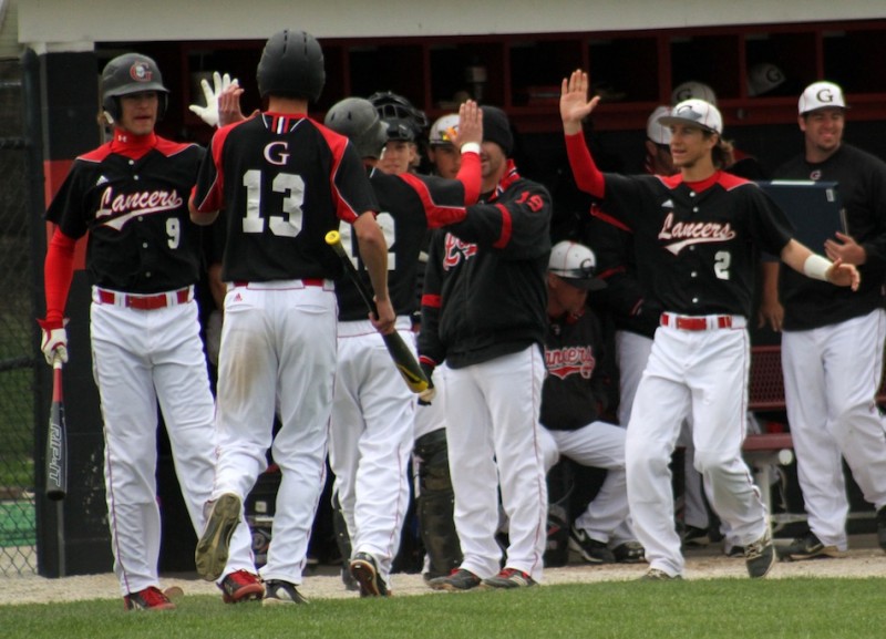 Members of the Grace College baseball team congratulate one another Thursday. The Lancers swept a conference twin bill from Bethel at Miller Field (Photo provided by Grace College Sports Information Department)