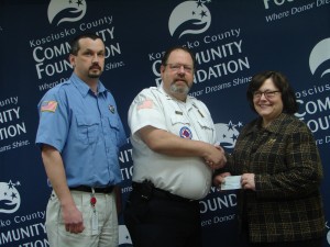 From left are John Conley of Silver Lake and Bob Haines of Claypool, members of KC Fire Association, presenting a donation to the Firefighters Communication Fund. (Photo provided)