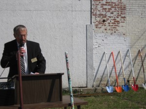  LaCasa, Inc. President Larry Gautsche addresses the public at the Hawks Arts and Enterprise groundbreaking ceremony, with the ceremonial shovels in the background. (Photo provided)