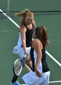 Erin Wiktorowski congratulates her doubles partner Aubrey Schmeltz during their match against Kayci Troyer and Amy Harris.