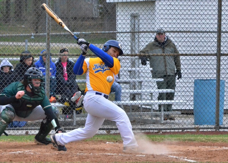 Noah Hamilton hits a ball foul early in Monday's 17-10 win for East Noble. Hamilton had one RBI and scored three runs for the Knights. (Photos by Nick Goralczyk)
