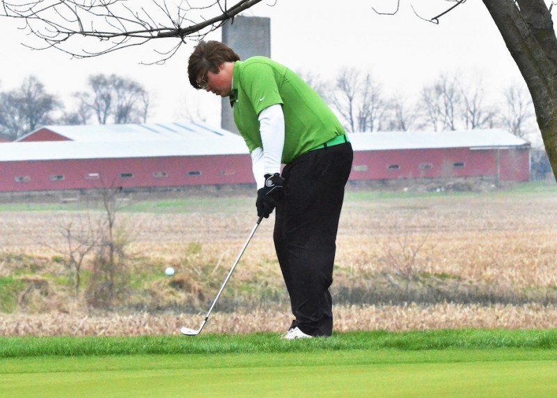 Tristen Atwood chips on to the number two green on Monday night.