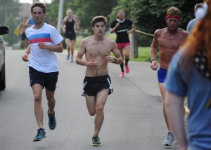 Runners flow in to the finish of the 2013 Flotilla Road Race in Syracuse. (File photo by Mike Deak)
