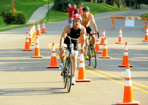 Clint Pheras makes his way into the transition area before winning the 2013 Wawasee Kiwanis Triathlon. (File photo by Mike Deak)