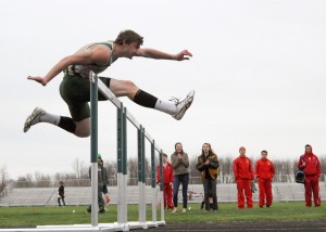 Wawasee's Clayton Cook sails over the hurdle in a 13.90 win in the 110-meter hurdles race against Plymouth Thursday night. (Photos by Mike Deak)