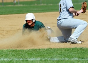 Nate Hare of Wawasee slides into third under the tag attempt of South Bend Riley's Alex Wieczorek at the Wawasee Baseball Invitational.