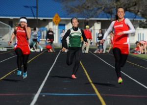 Wawasee's Sam Malik sprints to the finish against Goshen's WHO, left, and Plymouth's WHO during the 100-meter dash Wednesday evening at Goshen.