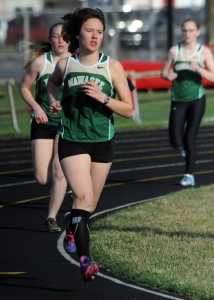 Wawasee's Elizabeth Zorn leads teammates Bridgette Yoder and Bailey Schroeder around the bend during the 1600-meter run against Goshen and Plymouth Wednesday night.