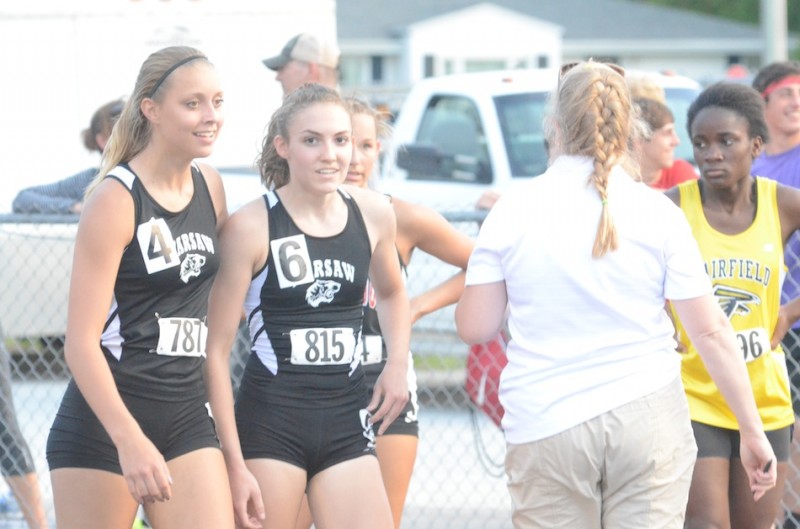 Samantha Alexander (left) and Audrey Rich chat after the 200. Rich won the race and Alexander was fourth for Warsaw.