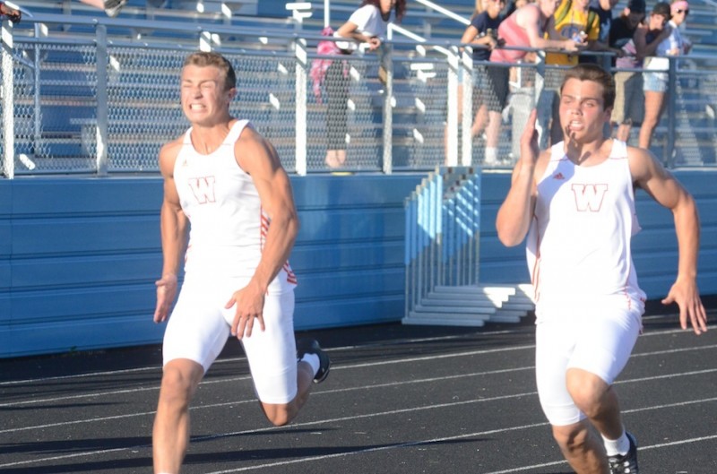 Seniors Michael Miller (left) and Tristan McClone go all out in the 100-meter dash. The duo are both headed to the State Finals in the event.