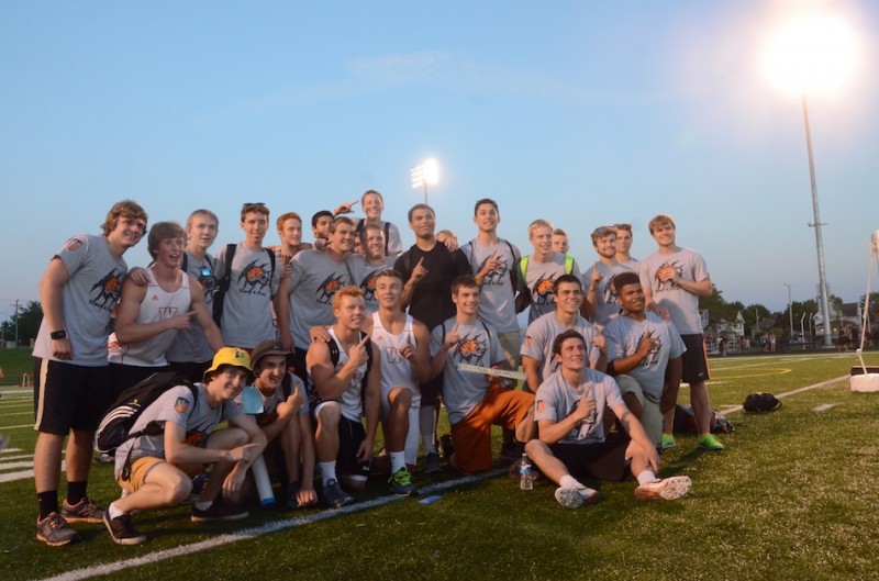 The Warsaw boys track team strikes a championship pose Thursday night. The Tigers won the South Bend St. Joseph Regional.