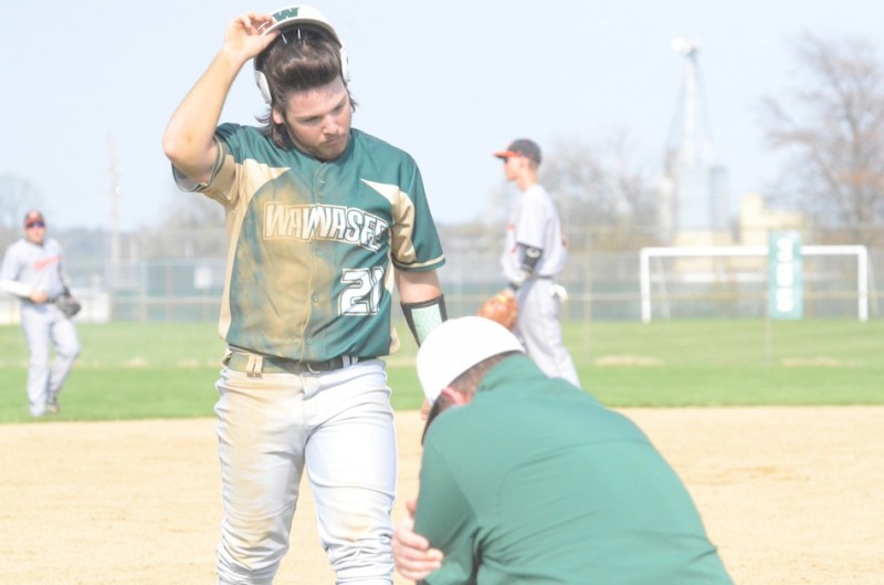 Nate Prescott heads to the dugout for Wawasee.