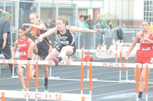 Jackie Ferguson was second in the 100 hurdles to help Warsaw win another conference championship.