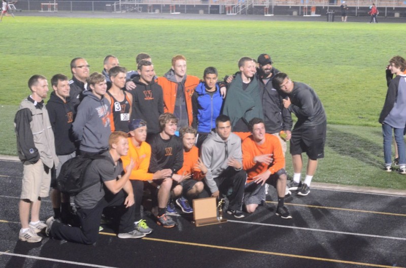 The senior members of the Warsaw boys track team are all smiles after winning the NLC Meet Tuesday night.