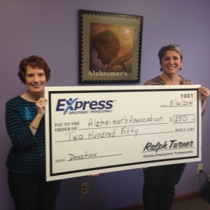 Ann Hathaway, Northern Indiana Director, and Lori Stock, Care Consultant, receiving donation for the Alzheimer’s Association. 
