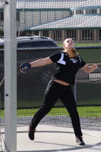 Emily Bailey competes in the discus for Warsaw.