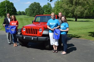 Shown with a 2013 Sport Wrangler Jeep that could be won with a hole in one on number 13 at Tippecanoe Lake Country Club are, from left, Ted Nine, owner of Warsaw Autoplex; Connie Geer, coordinator of the Boomerang Backpacks program for Wawasee schools; Tracey Akers, representing the Boomerang Backpacks program for Warsaw schools; Darren Parker, teacher in the Tippecanoe Valley School district and representing Boomerang Backpacks; and Joelle Schram, a junior at Warsaw Community High School who helps with the Boomerang Backpacks program. The second annual Boomerang Backpacks Golf Outing will be held June 16 at Tippecanoe Lake Country Club.
