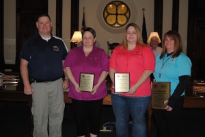 Several 911 dispatchers were honored at Monday’s county commissioners meeting. The dispatchers were honored for their work when numerous school buses collided in North Webster in May 2013. Pictured, from left, are 911 Director David Rosenberry, Dispatcher Trina Gard, Dispatcher Jessica Scheil and Assistant 911 Director Sarah Lancaster. Not Pictured is Dispatcher Tina Cook.
