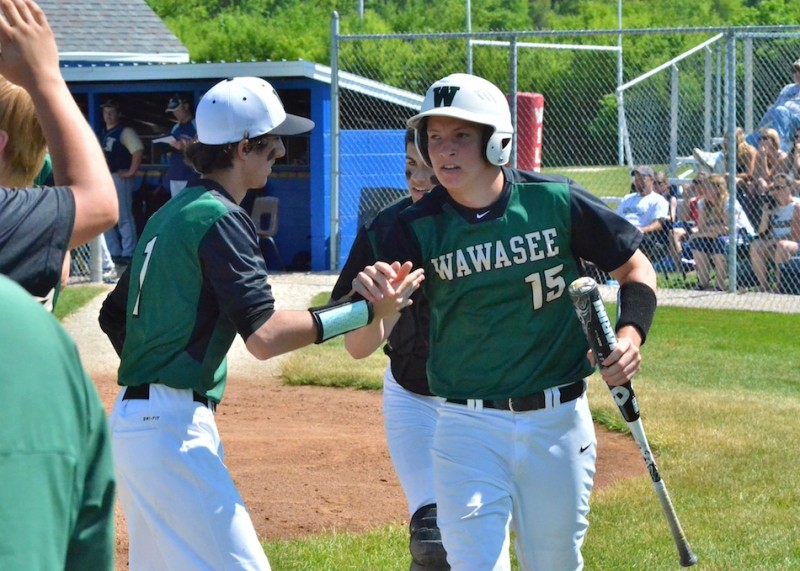 Caleb Dingeldein is congratulated by Andrew Milligan after Dingeldein scored a run in the bottom of the first inning. (Photos by Nick Goralczyk)