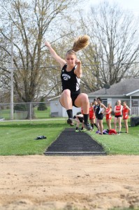 Samantha Alexander soared to victory in the long jump for undefeated Warsaw in a win over Goshen Tuesday night (Photos by Amanda Farrell)