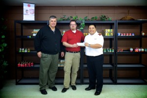 From left are Ken Locke, Community Ministries director for The Salvation Army; Ben Thornburgh, owner of Thornburgh Honey Farms; and Lt. Esteban Pommier Commanding Officer at The Salvation Army. (Photo provided) 