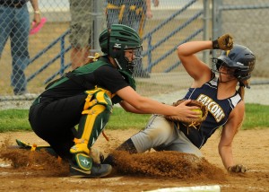 Wawasee catcher Paige Hlutke puts the tag on Fairfield's DJ Martz at home plate for an out during Wawasee's 5-2 win over Fairfield in the Fairfield Softball Sectional semi-finals Wednesday night. (Photos by Mike Deak)
