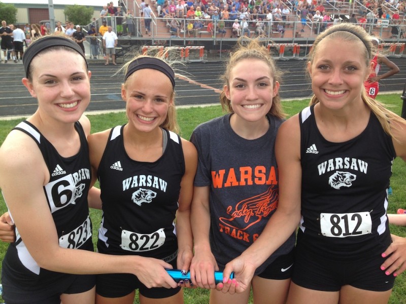 The Warsaw 4 X 100 relay team set a school and regional record Tuesday night to help the Tigers win a third straight regional championship. The team above (from left) was Ann Harvuot, Mariah Harter, Audrey Rich and Samantha Alexander. 