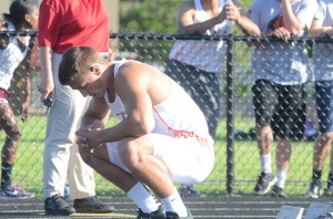 Warsaw senior Michael Miller collects his thoughts prior to a race at the regional last week. Miller will compete in the 100 and the 4 X 100 relay at State.