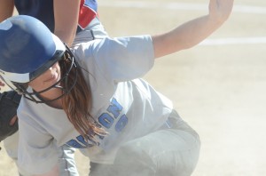 Allyson Brown calls time after getting back safely into first base.