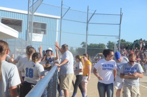 Mallorie Jennings is congratulated by her team after a home run.