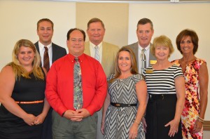 Dr. Craig Hintz Stands with his cabinent (from left) Nicole Wills, assistant to the superintendent; Dr. David Hoffert, Assistant Superintendent; Brad Hagg, chief technology officer; Dr. Craig Hintz, superintendent; Amy Sively, chief accountability officer; Kevin Scott, chief financial officer; Deb Blatz, director of special services; and Wendy Long, director of communications and language programs.  (Photo by Alyssa Richardson)