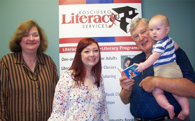 Pictured is John Elliott, at right, trust officer from 1st Source Bank, with mother and son Annalyse and Blake Watters, and KLS Executive Director Cindy Cates at left. Blake received an ABC Board Book when he was born at Kosciusko Community Hospital.