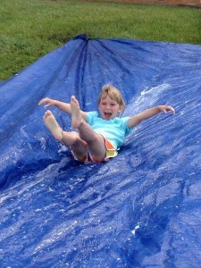  Ella Thomas from Mrs. Bruce's kindergarten class enjoys the slip and slide.  (Photo provided)