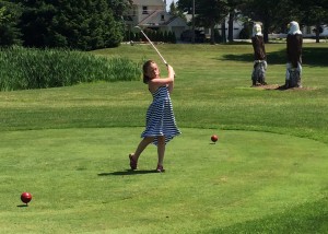 First-time golfer Karley Duncan tees off on number four at the Shore. 
